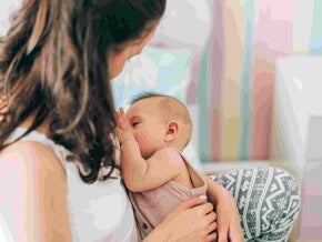 Mujer con bebé en brazos La lactancia materna es su mejor alimento